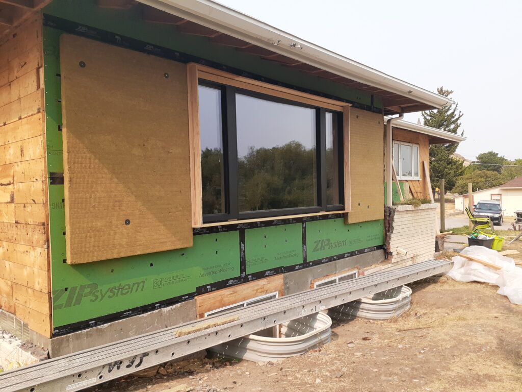 High-performance window installation and exterior insulation detailing as part of a deep energy retrofit project