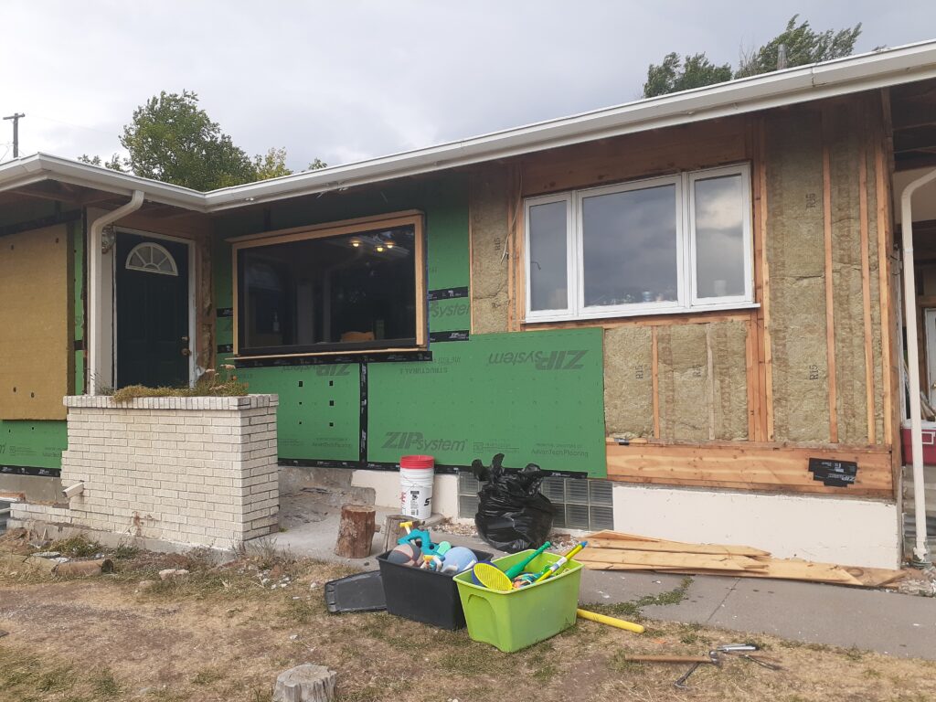 Installing batt insulation and an airtight layer to maximize building durability and operational efficiency.