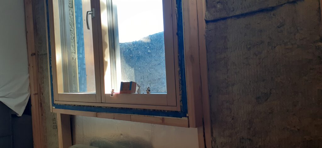 Passive House retrofitting strategies for high performance window installation.